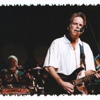Bob Weir, with Bill Kreutzmann in the background