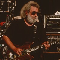 Photo of Jerry Garcia playing guitar